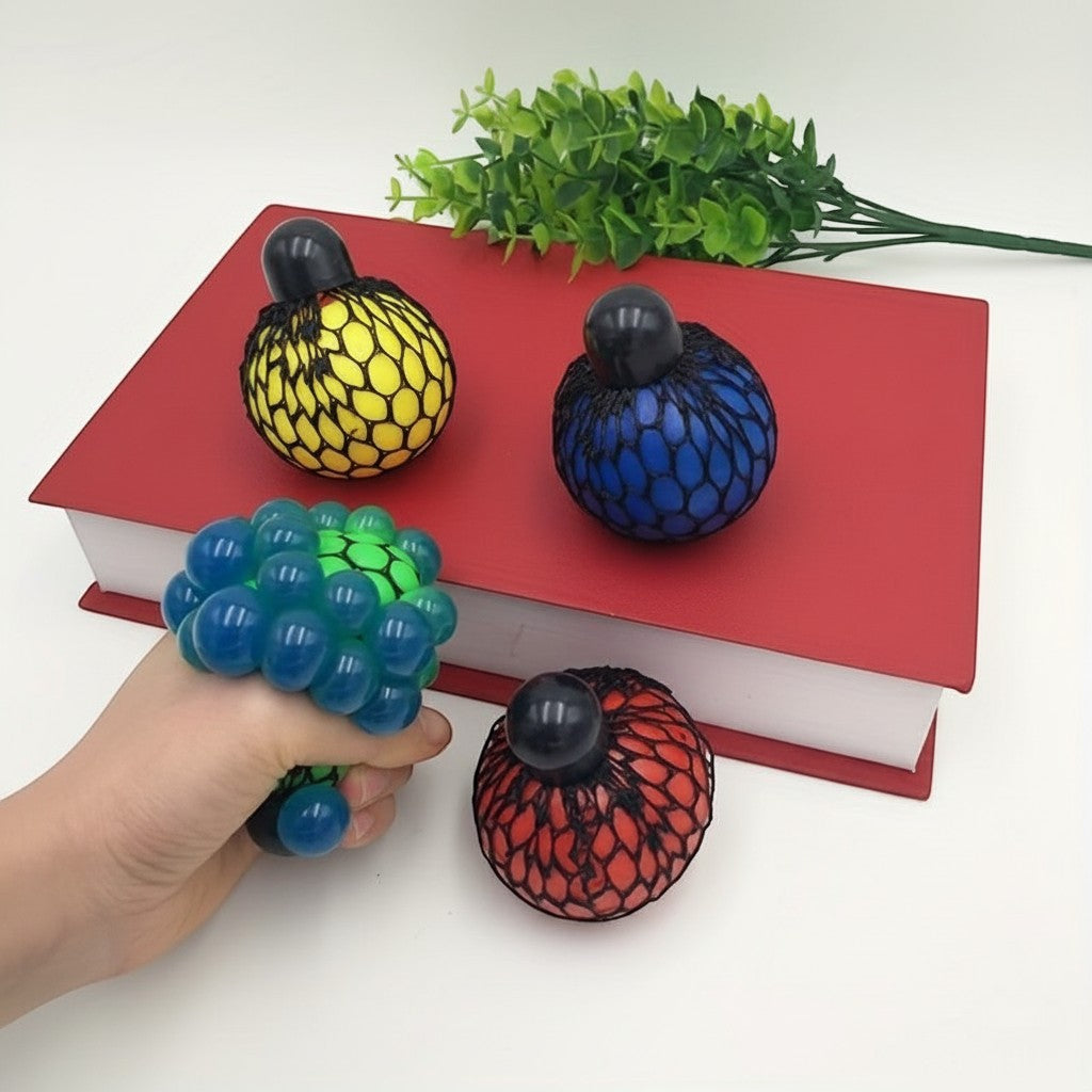 Juvins grape shaped squishy stress ball with blue, green, yellow, and red balls inside a mesh.